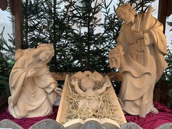 Low angle view of statue against trees