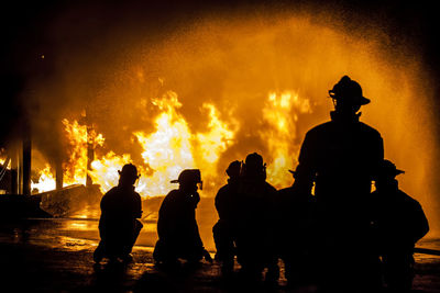 Silhouette of firefighters