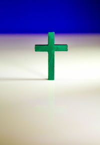 Close-up of cross on metal