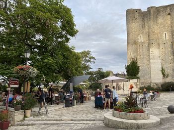 People at town square against sky