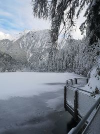 Scenic view of snowcapped mountains by lake against sky