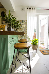 Stools at breakfast bar at home