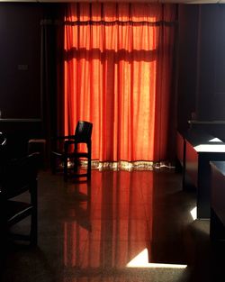 Empty chairs and table in room