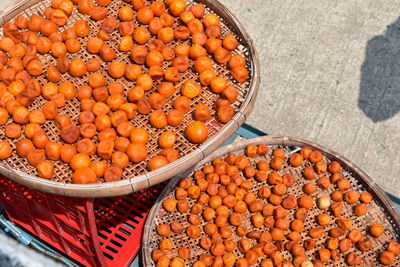 High angle view of orange fruit in market