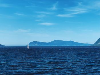 Sailing in a wilderness environment on a sunny day, blue rippled sea, blue sky, natural background 