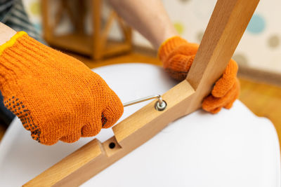 Cropped hand of woman holding key