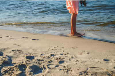 Low section of woman on beach