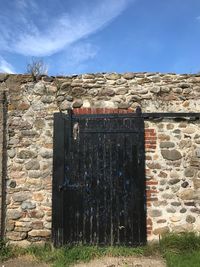 Entrance of building against blue sky