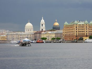 View of buildings against cloudy sky