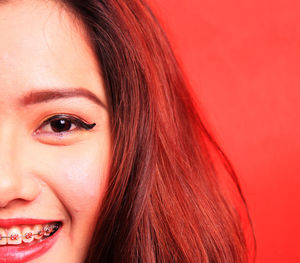 Close-up portrait of a smiling young woman