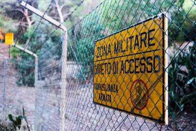 Information sign on chainlink fence