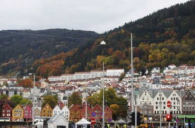 High angle view of buildings in town against sky