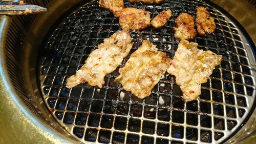 Close-up of meat on barbecue grill