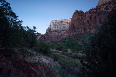 Low angle view of rock formations against sky