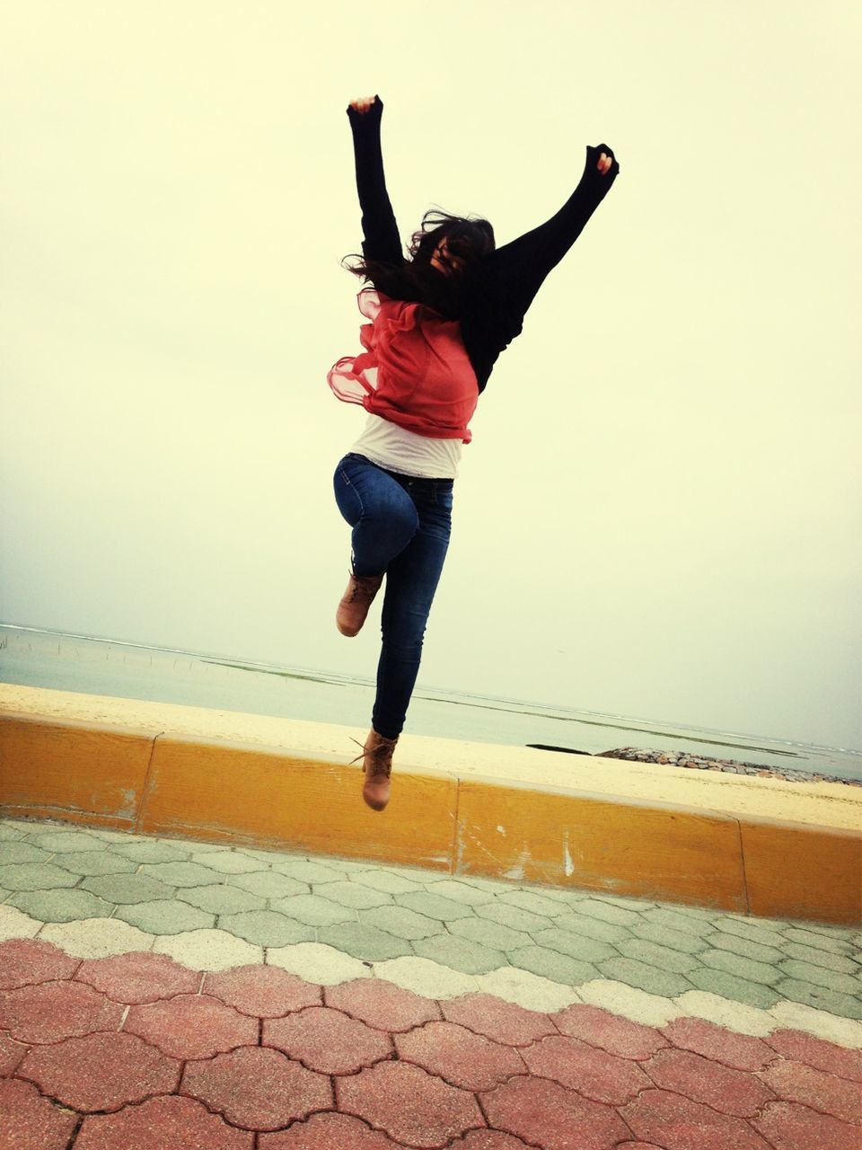 WOMAN JUMPING IN SEA