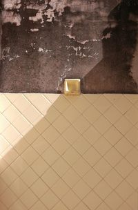 High angle view of tiled floor in bathroom