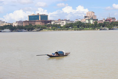 People kayaking in sea