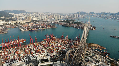 High angle view of harbor and buildings in city