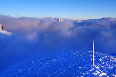 Scenic view of snowcapped mountains against sky