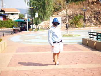 Rear view of boy in city