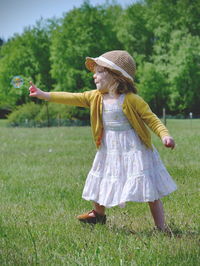 Little girl popping bubble