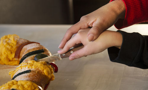 Midsection of man preparing food on table