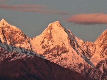 Scenic view of snowcapped mountains against sky during winter