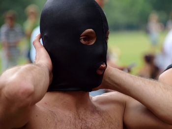 Close-up portrait of shirtless man