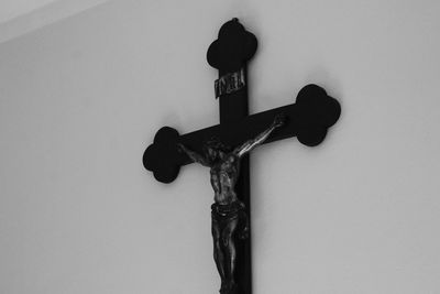 Close-up of faucet against white wall