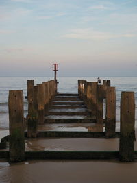 Pier over sea against sky