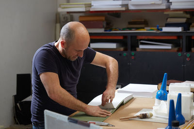 Mature man working in workshop