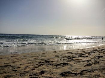 Scenic view of beach against clear sky