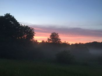 Scenic view of landscape at sunset