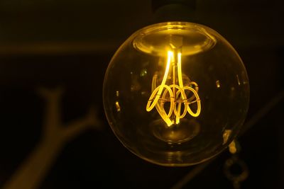 Close-up of illuminated light bulb