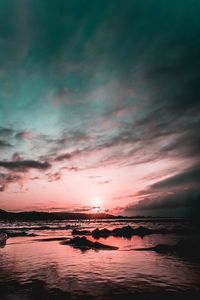 Scenic view of sea against sky at sunset