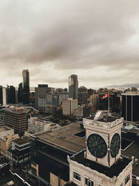 High angle view of buildings in city against sky