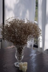 Close-up of vase on table at home