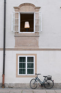 Bicycle on street against building