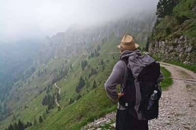 Rear view of man looking at mountains