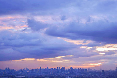 Aerial view of city at sunset