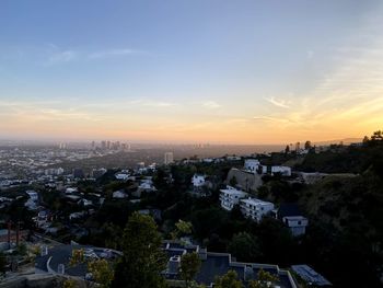 High angle view of townscape against sky at sunset