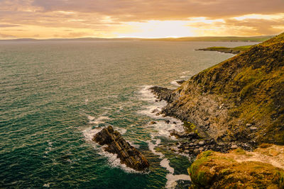 Scenic view of sea against sky at sunset