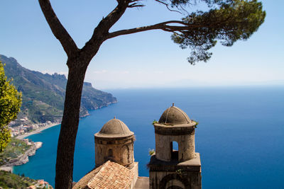 Panoramic view of sea and mountains against sky