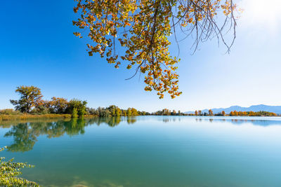 Scenic view of lake against sky during autumn