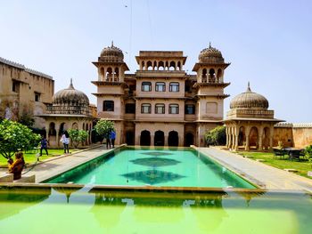 View of swimming pool in front of building