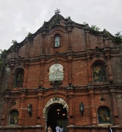 Low angle view of historic building against sky