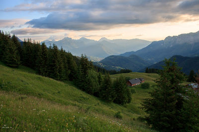 Scenic view of landscape and mountains against sky