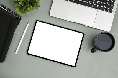 High angle view of digital tablet on table