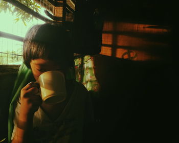 Girl drinking coffee at home