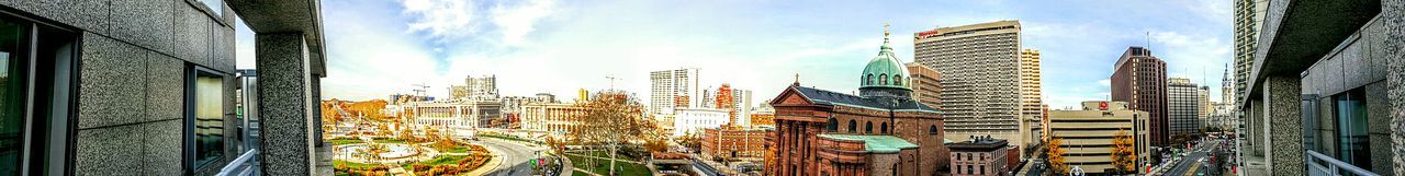 Buildings in city against sky